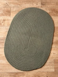 Northshire Solid Color Oval Braided Wool Rug