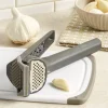 Self-Cleaning Garlic Press